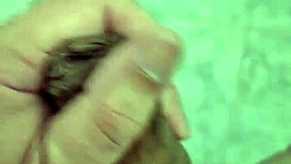 Well-endowed young man plays in the shower