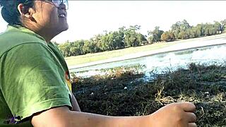 wife giving blowjob by the lake in public