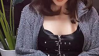 beautiful japanese ladyboy in cat ears strokes cock while crossdressing.