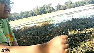 wife giving blowjob by the lake in public