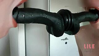 Blonde babe deepthroats dildo, her shaved pussy gets wet