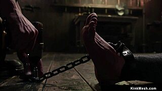 Man, busty slave mummified and chained for rough play