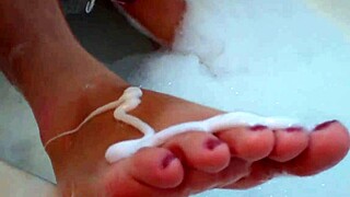 A brunette with big natural tits shows off her tight body and feet in a casual display