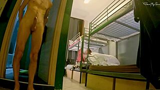 A young woman flashes in a hostel mixed room shower.