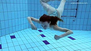 Skinny teen Anna Netrebko in bikini underwater.