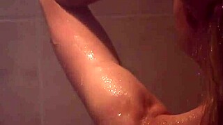 Sexy blonde has sex in the shower.
