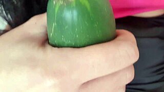 Mature woman enjoys a relaxing massage with a cucumber