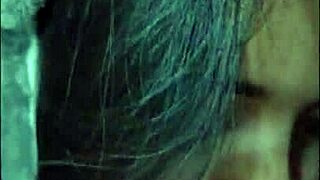 White wolf watches as she sucks young white moon eagerly