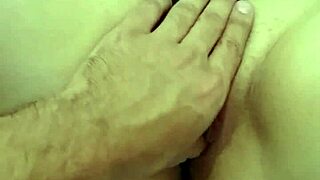 The redhead masturbates, caressing her pink pussy and big ass