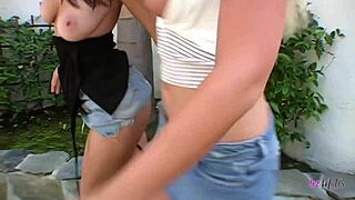 Brunette dyke and busty blonde pawg pound each other with strapon