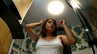 The redhead girlfriend was in the bathroom without panties, wearing a miniskirt, and her friend was there.