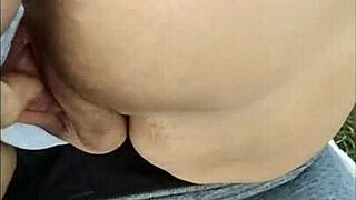 I masturbate my pussy in the field.