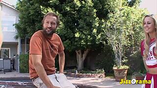 Blonde cheerleader gets drilled outdoors by two guys in wild group action.