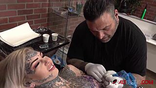 Sascha interacts with Amber Luke during her tattoo session.