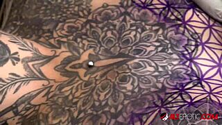 Sascha interacts with Amber Luke during her tattoo session.