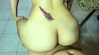 mature wife shows her huge ass in the kitchen.