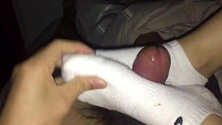 female colleague in white socks gives footjob until he cums on foot