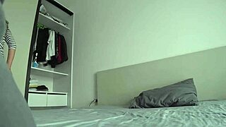 wife cheats with family friend on double bed while husband works.