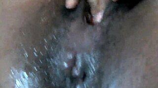 Ebony woman squirts during masturbation