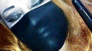 Bound Woman Masturbates With Black Dildo Under Face Mask.