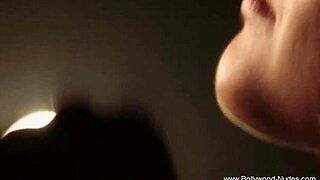 An asian brunette dances erotically, stripping and seducing with teasing moves, ripping clothes to reveal nude body in softcore scene.