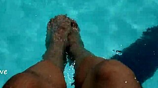 Feet splashing in the pool with lots of water