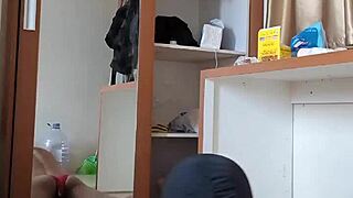 A sexy gay shemale in red crossdresser outfit and mask plays with toys and dildo in anal fun