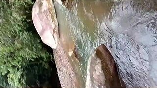 Alexachris20 fucks a stranger in the hot river outdoors.