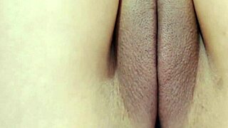 A young woman showcases her smooth, peachy shaved intimate area