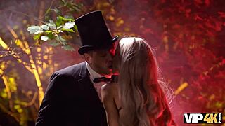 Blonde witch performs a ritual with her partner outdoors