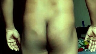 Sexy male bodybuilder displays his athletic physique and muscular build.