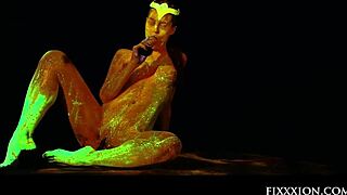 brunette goddess glows in the dark while masturbating with dildo