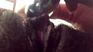 the tight pink pussy glistens wet with toys inserted deep