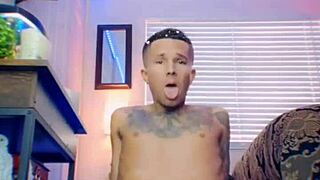 Adorable twink with tattoos spanks his tight ass before riding a big dildo