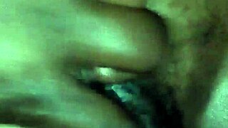 rubbing body oil on a black milf