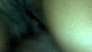 rubbing body oil on a black milf