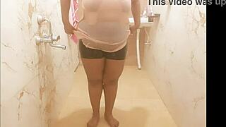 Thailand lady playfully bathes in the shower, showcasing her beauty