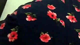 chatting with the neighbor in her floral dress