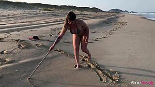 Watch this blonde bend over for her fan on the beach!