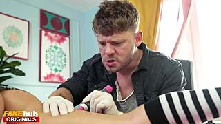 hot tattooed brunette with perfect body interacts during her tattoo session