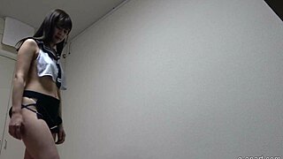 japanese girl in uniform does exercises in the room on webcam with miniskirt and skirt costume