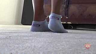 Ebony cougar shows puma socks and ass.