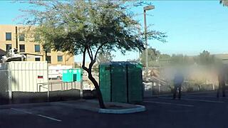 Porta gloryhole at construction site offers blowjobs and cum swallowing in outhouse