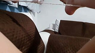 Latina pornstar masturbating intensely on wet sofa, cum dripping down her leg.