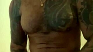 Tattooed Viktor Rom strokes his huge Latino cock