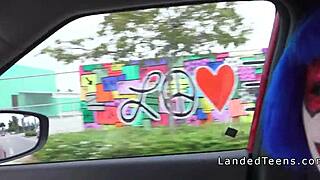 A clown teen sucks cock outdoors in POV.