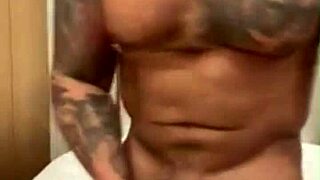 Tattooed Viktor Rom strokes his huge Latino cock