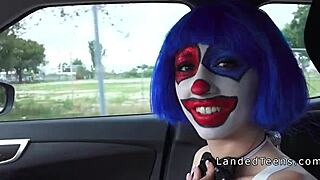 A clown teen sucks cock outdoors in POV.