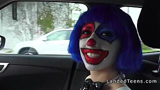A clown teen sucks cock outdoors in POV.