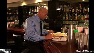 Hottie long-haired gay man with tattoos sucks big cock in office blowjob, leading to hardcore fucking and cumshot on bald guy at work